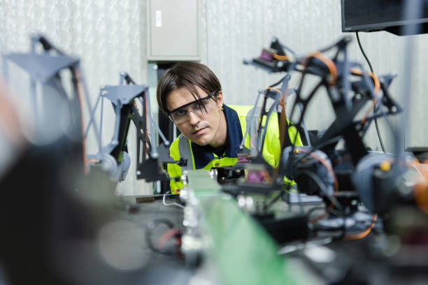 istock Male technician engineer checking automation robotics at industrial modern factory. man working at factory innovation automation robot. technical professional operation. 1677511286