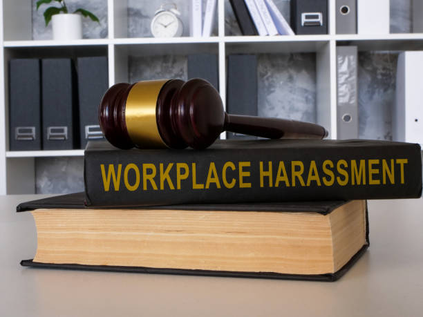 istock A book Workplace harassment with gavel lies on the office table. 1677542126