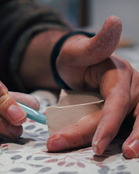 istock a person models a figure with clay 1677570465