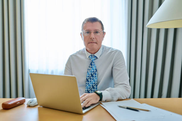 istock Confident mature male leader manager at workplace, in office 1677586870