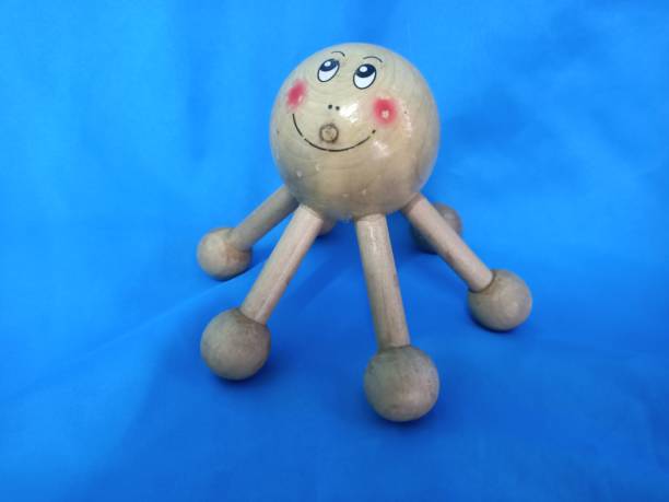 istock 6 leg octopus Palm  Massager for relaxation and Back massager on blue background 1677597311