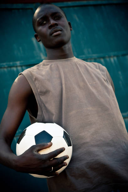 istock African Man Holding A Soccer Ball 167760668