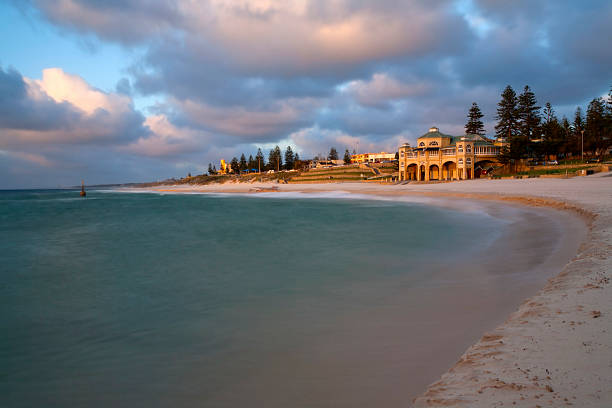 Cottesloe Beach at Dawn The first sunlight of a new day illuminates the seafront at Cottesloe, one of Perth's busiest beaches, Western Australia cottesloe stock pictures, royalty-free photos & images