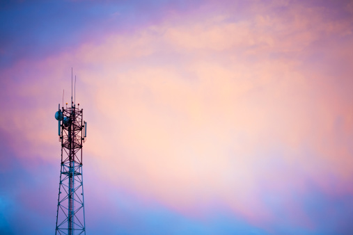 Cellular tower at sunset. Copy space.