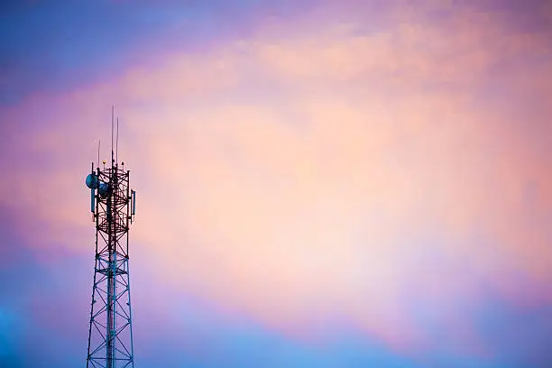 Cellular tower at sunset. Copy space.