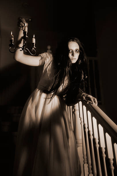 istock Ghost of a woman creeping down the stairs 167761028