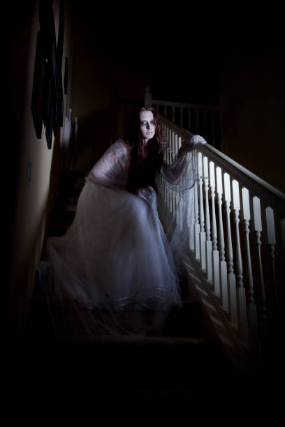 istock Ghost of a woman creeping down the stairs 167761059