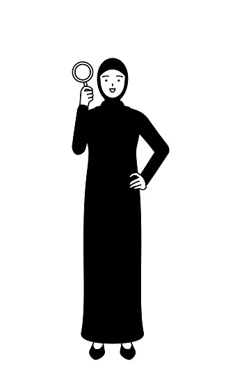 Muslim Woman looking through magnifying glasses