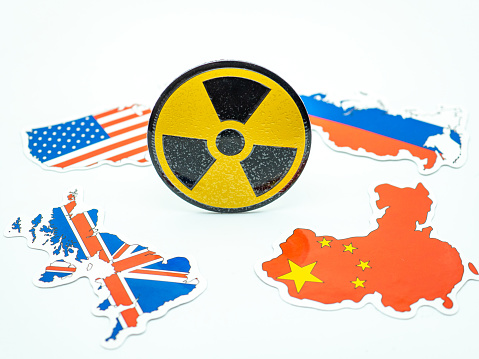 nuke radioactive sign and country maps of us, russia, uk, china