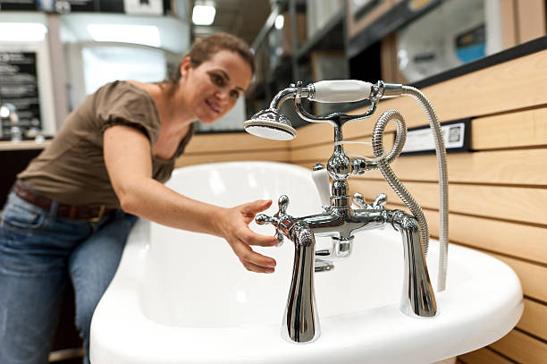mature woman looking at a brand new bath tub
