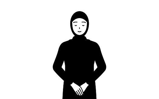Muslim Woman bowing with folded hands.