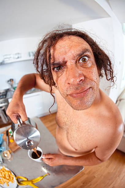 Coffee Time An Unemployed bachelor pours himself a cup of coffee. (fisheye lens used) tramp home stock pictures, royalty-free photos & images