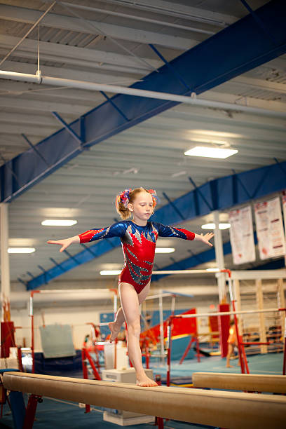 istock Young Gymnast Doing Routine on Balance Beam 167762234