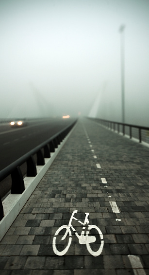 Bike lane on a foggy day. Tilt shift lens to increase the foggy atmosphere.