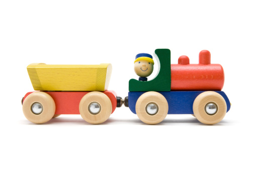 Wooden toy train isolated on a white background.