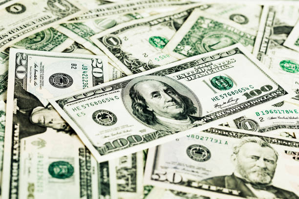istock $100 note tops a pile of money 167762992