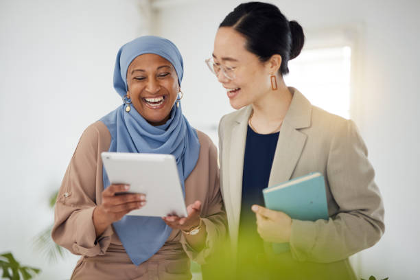 istock Teamwork, funny and tablet with business people in office for support, diversity and meeting. Digital, brainstorming and idea with employees in creative agency for website, designer and solution 1677648615