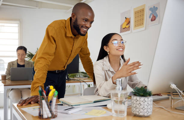 istock Coaching, consulting and computer with business people in office for creative, planning and training. Teamwork, collaboration and feedback with employees in digital agency for website and designer 1677664086
