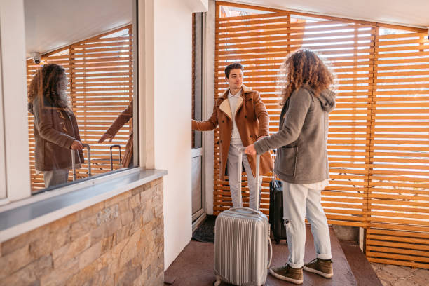 istock Young Couple Entering A Hotel Room 1677669123