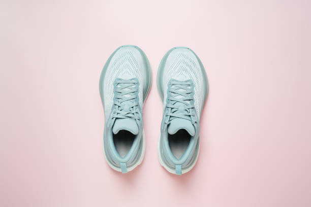 istock New female modern running shoe on pink 1677670831