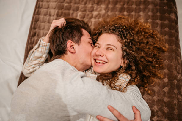 istock Young Couple Lying On The Bed 1677672979