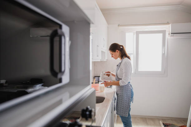 istock girl baking in the kitchen 1677672983