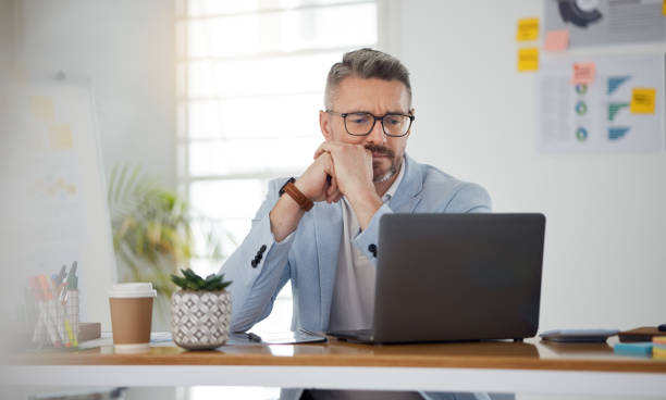 istock Laptop, thinking and error with a business man in the office for problem solving an issue as a manager. Computer, 404 and confused with a corporate employee in doubt about an idea, report or info 1677682109