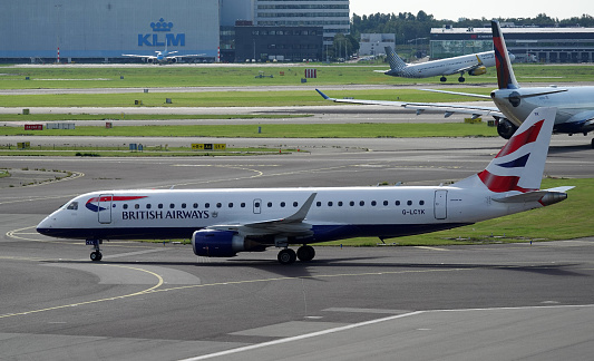 Schiphol, The Netherlands - August 14 2023: Airplane from British Airways is leaving. BA CityFlyer Embraer E190SR G-LCYK