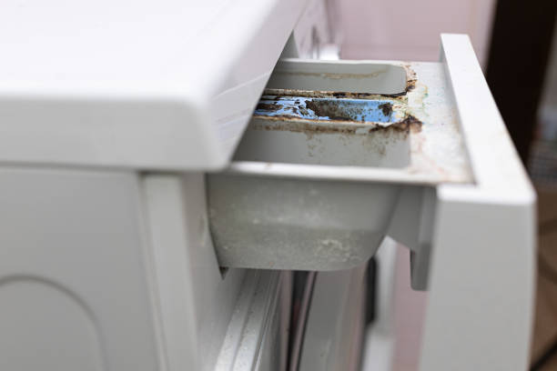 istock Close up washing machine dispenser tray for detergent and conditioner with corrosion, rust, pitting, mold and limescale. 1677696307
