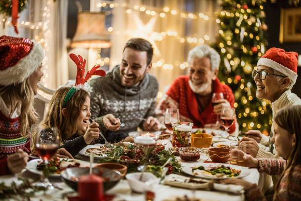 istock Family's New Year's Eve at dining table! 1677697410