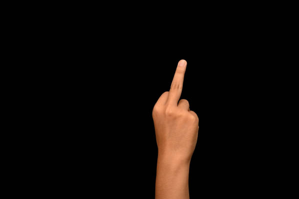 istock Man showing middle finger on black background. Bad expression, provocation, rude attitude and offensive gesture 1677699619