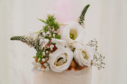 A beautiful wedding cake with natural flowers