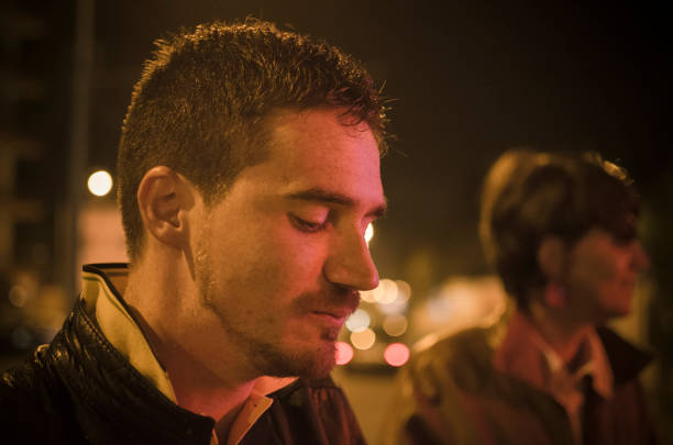 istock young man outdoors in the night pensive 167771007