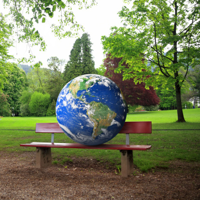 close up shot of the Earth on a bench in park.