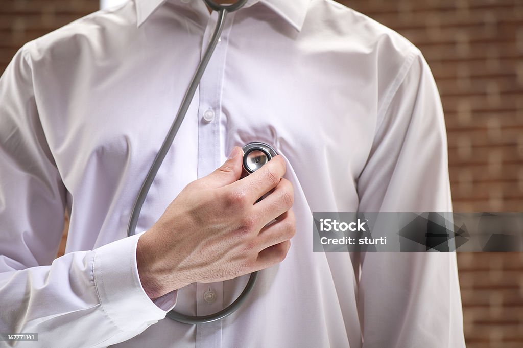 annonymous male checks heart young male checks heart, maybe after splitting from his girlfriend 20-29 Years Stock Photo