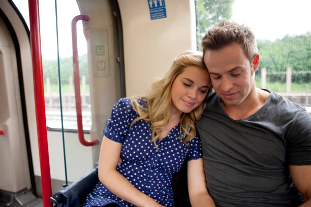 istock Couple hugging on a train looking a away from camera 167771629