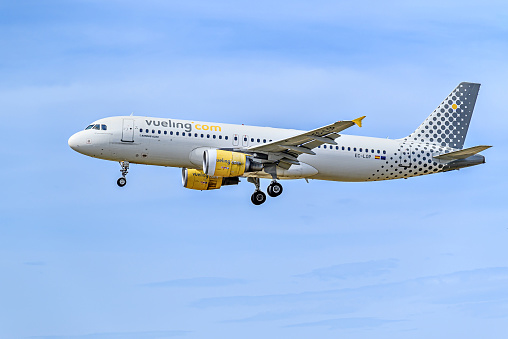 Barcelona, ​​Spain; April 10, 2023: Vueling Airbus A320 plane, landing at Josep Tarradellas Barcelona-El Prat airport