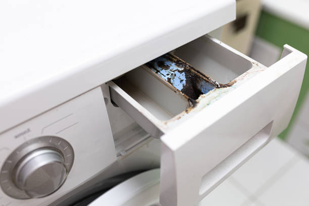 istock Close white washing machine with open empty dispenser tray without detergent with mold dirt, scale. Corrosion protection 1677746580
