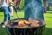 Man roasting on barbecue grill