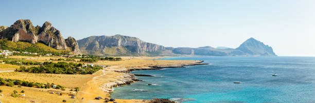 istock Panoramic View of a Beautiful Coastline with a Pebble Beach and a Mountain Range in the Background. Western Sicily. 1677764073
