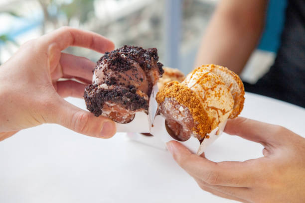 Gelato mini sandwich between mini donuts, chocolate and lotus flavour.