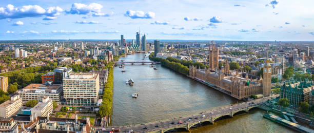 istock Westminster Big Ben and Thames riverfront panoramic view in London 1677785177