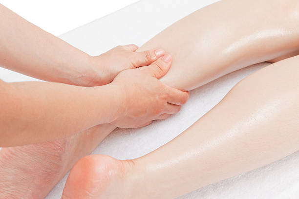 Foot Massage Female calf foot massage hand Motegi pressure point photos stock pictures, royalty-free photos & images