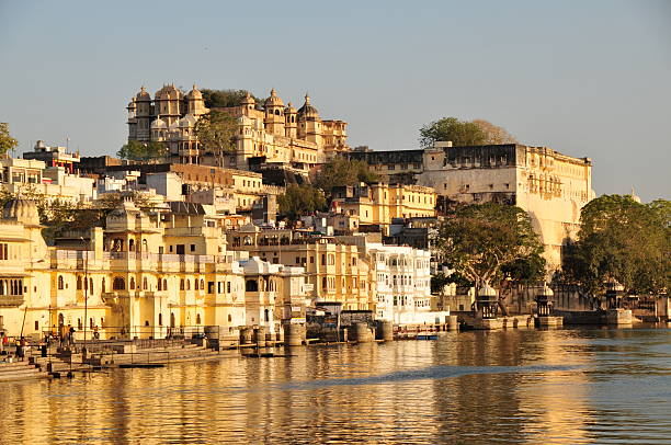 City Palace,Udaipur,Rajasthan,India. Telephoto image of City monument reflected in Lake Pichola shot in afternoon. udaipur stock pictures, royalty-free photos & images