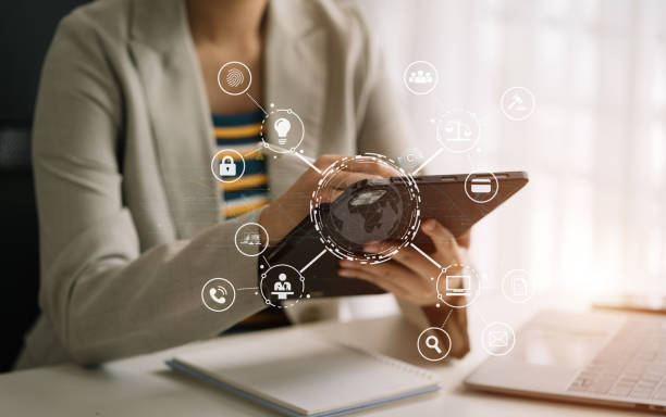 istock Copyright or patent concept, Person hand using laptop computer, tablet and smartphone with virtual screen copyright icon trademark, Creation ownership against piracy at office. 1677828909