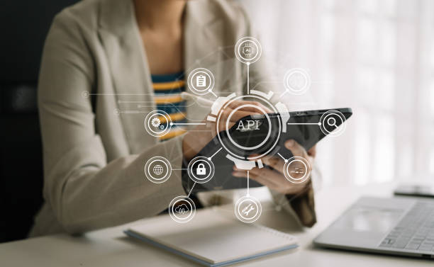 istock Modern technology and networking concept, woman using laptop, tablet and smartphone with virtual screen API icon Software development tool. API Application Programming Interface. 1677828913
