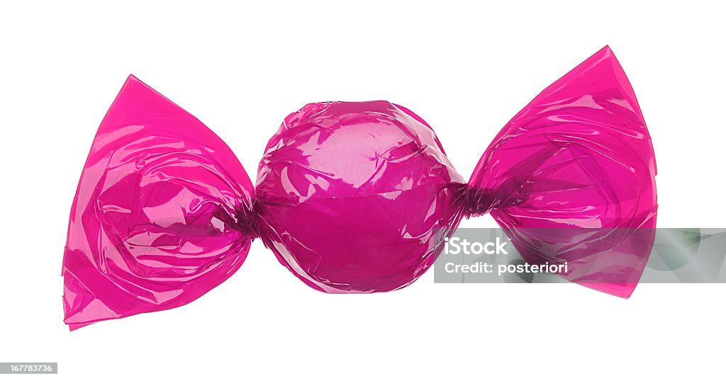 candy wrapped in pink foil candy in pink wrapper isolated on white Candy Stock Photo