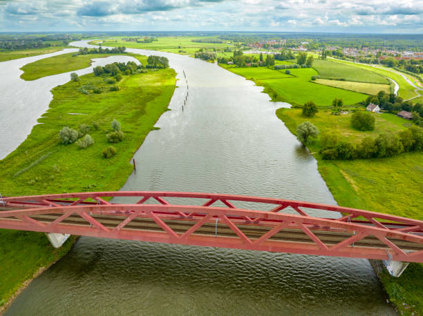 istock Hanzeboog train bridge over the river IJssel from above 1677843374