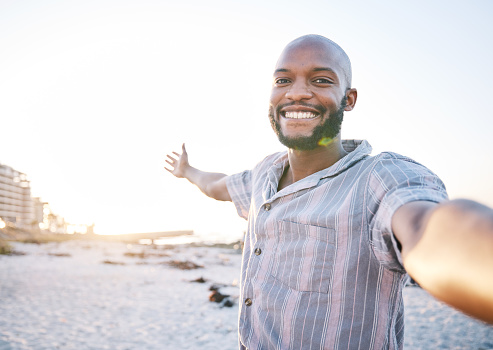Selfie, beach and man with a smile for travel, social media and profile picture with freedom. Sea, African male person and portrait with photo with vacation and holiday influencer post on Miami trip