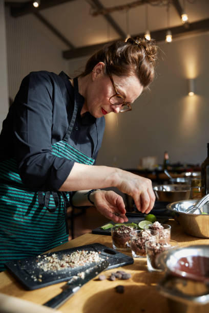 istock Woman prepares food 1677896520
